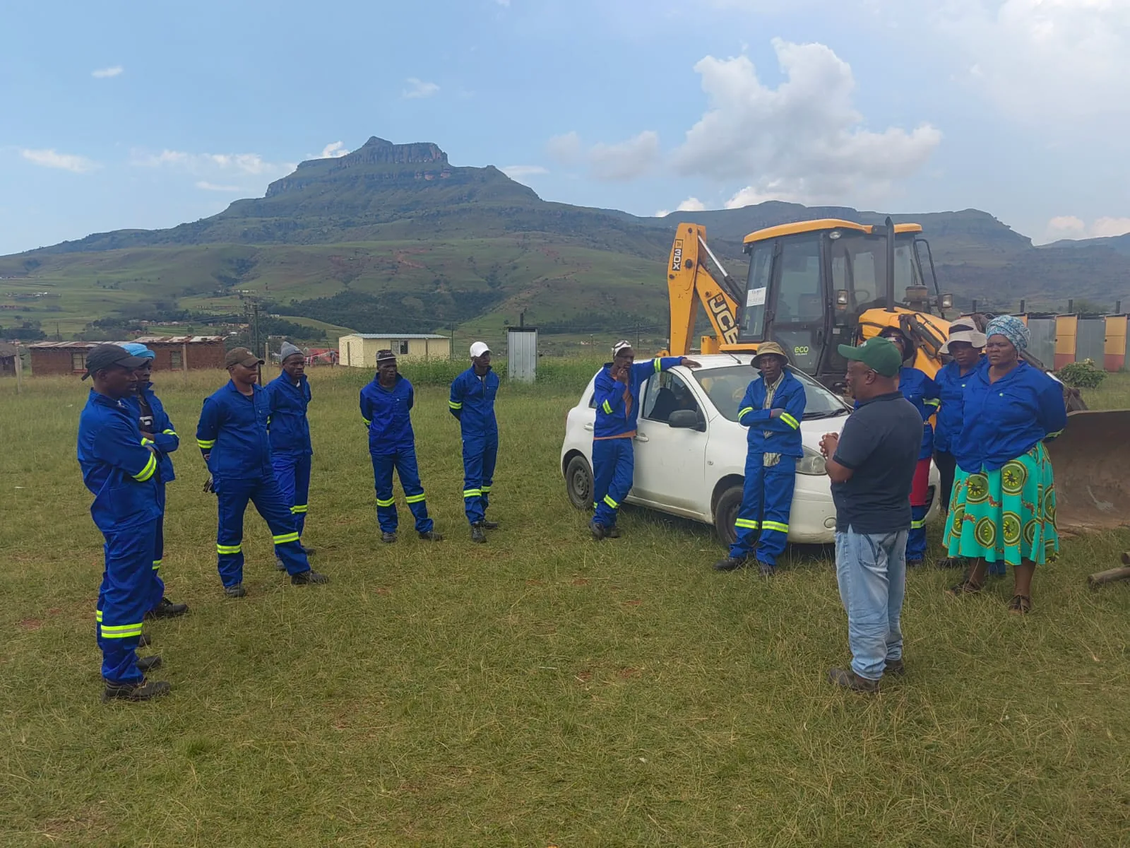 MADCON Engineering team meeting on a construction site near plant equipment